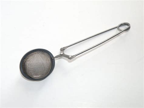 vintage mesh fabric strainer with metal rings on ends|Antique Mesh Strainer .